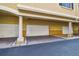 Building featuring multiple garages with well-maintained brick driveway at 119 Beach Haven Ln, Tampa, FL 33609