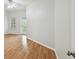 Spacious living room with hardwood floors and a door leading to the outside at 119 Beach Haven Ln, Tampa, FL 33609