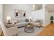 Bright living room with high ceilings, neutral decor, comfortable seating, and lots of natural light at 119 Beach Haven Ln, Tampa, FL 33609