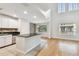 Bright living room featuring hardwood floors, high ceilings, and abundant natural light from large windows at 119 Beach Haven Ln, Tampa, FL 33609