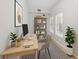 Bright home office with natural light, modern desk, shelving, and stylish black and white rug at 119 Beach Haven Ln, Tampa, FL 33609