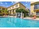 Community pool area with poolside furniture and a decorative water fountain feature at 119 Beach Haven Ln, Tampa, FL 33609