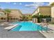Stunning community pool surrounded by lush landscaping, creating a tranquil and inviting atmosphere at 119 Beach Haven Ln, Tampa, FL 33609