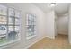 Bright room with tiled floors, large windows offering neighborhood views, and neutral paint provide a welcoming atmosphere at 119 Beach Haven Ln, Tampa, FL 33609