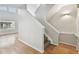 Carpeted staircase with white banisters, recessed lighting, and a view to the exterior at 119 Beach Haven Ln, Tampa, FL 33609