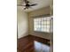 An empty bedroom with hardwood floors and natural light from the window at 125 Grand Beach Pl # 125, Tampa, FL 33609