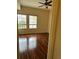 Bedroom featuring two windows and hardwood flooring at 125 Grand Beach Pl # 125, Tampa, FL 33609