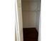 Empty walk-in closet with wire shelving and hardwood floors at 125 Grand Beach Pl # 125, Tampa, FL 33609