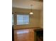 Dining area with wood flooring and a window with blinds at 125 Grand Beach Pl # 125, Tampa, FL 33609