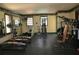 Community gym with modern weight training equipment and mirrors at 125 Grand Beach Pl # 125, Tampa, FL 33609