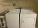 Functional laundry room features a washer, dryer, and water heater for convenience at 125 Grand Beach Pl # 125, Tampa, FL 33609