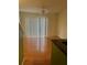 Open living space with wood floors, neutral paint, and sliding glass doors at 125 Grand Beach Pl # 125, Tampa, FL 33609