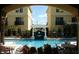 Community swimming pool with chairs, tables, and white pergolas at 125 Grand Beach Pl # 125, Tampa, FL 33609