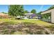 Spacious backyard with screened-in pool, covered patio, and lots of space for recreation at 15348 Glossy Ibis Rd, Weeki Wachee, FL 34614
