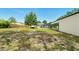 Expansive backyard featuring lush greenery and mature trees, perfect for outdoor activities at 15348 Glossy Ibis Rd, Weeki Wachee, FL 34614
