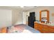 Comfortable bedroom featuring ample closet space and a dresser with a mirror at 15348 Glossy Ibis Rd, Weeki Wachee, FL 34614