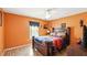 Inviting bedroom with a wooden bed frame, accent wall, and stylish décor at 15348 Glossy Ibis Rd, Weeki Wachee, FL 34614