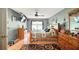 Spacious bedroom featuring wood floors, a ceiling fan, and a large window for ample natural light at 15348 Glossy Ibis Rd, Weeki Wachee, FL 34614