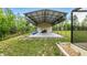 View of the spacious carport with steel frame located next to the screen enclosed lanai at 15348 Glossy Ibis Rd, Weeki Wachee, FL 34614