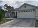 Charming single-story home with a well-maintained front yard and driveway at 15348 Glossy Ibis Rd, Weeki Wachee, FL 34614