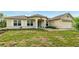 Charming single-story home featuring a well-maintained lawn and inviting curb appeal at 15348 Glossy Ibis Rd, Weeki Wachee, FL 34614