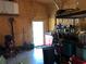 A garage space containing an assortment of tools and storage containers at 15348 Glossy Ibis Rd, Weeki Wachee, FL 34614