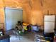 A large garage space featuring a mower and garage door at 15348 Glossy Ibis Rd, Weeki Wachee, FL 34614