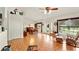 Bright, open-concept living room featuring tile floors and multiple windows for plenty of natural light at 15348 Glossy Ibis Rd, Weeki Wachee, FL 34614