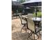 Covered outdoor seating next to a pool, perfect for entertaining guests at 15348 Glossy Ibis Rd, Weeki Wachee, FL 34614