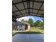 A beautiful pool area is visible from an enclosed metal patio at 15348 Glossy Ibis Rd, Weeki Wachee, FL 34614