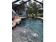 Inviting screened pool with multiple water features for outdoor enjoyment at 15348 Glossy Ibis Rd, Weeki Wachee, FL 34614