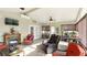 Relaxing sunroom featuring an electric fireplace and multiple windows for scenic views at 15348 Glossy Ibis Rd, Weeki Wachee, FL 34614