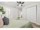 Bright bedroom with closet, ensuite bathroom, and view into adjacent living area at 1713 W Saint John St, Tampa, FL 33607