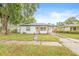 Charming home with a well-manicured lawn and inviting curb appeal at 1713 W Saint John St, Tampa, FL 33607