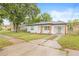 Stylish exterior showcasing the home's updated facade and landscape at 1713 W Saint John St, Tampa, FL 33607