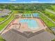 An aerial view of the community pool, tennis court and recreational area at 18620 Rococo Rd, Spring Hill, FL 34610