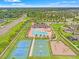 An aerial view of the community pool, clubhouse, and recreational facilities at 18620 Rococo Rd, Spring Hill, FL 34610