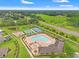 An aerial view of the community pool, park, and tennis courts at 18620 Rococo Rd, Spring Hill, FL 34610