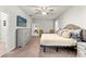 Spacious bedroom featuring carpeted floors, large dresser, neutral decor, and comfortable bedding at 18620 Rococo Rd, Spring Hill, FL 34610