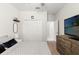 Cozy bedroom with large closet, ceiling fan, TV, and neutral carpet at 18620 Rococo Rd, Spring Hill, FL 34610