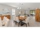Stylish dining area open to the living room and kitchen area; perfect for entertaining and everyday living at 18620 Rococo Rd, Spring Hill, FL 34610