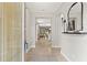 Bright and airy foyer leading into an open concept layout, showcasing the home's seamless flow at 18620 Rococo Rd, Spring Hill, FL 34610