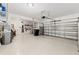 Spacious two car garage with epoxy floor, tool racks and overhead storage system at 18620 Rococo Rd, Spring Hill, FL 34610