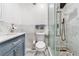 Elegant bathroom featuring marble walls, modern fixtures, and a glass-enclosed shower at 1881 N Hercules Ave # 602, Clearwater, FL 33765