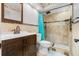 Charming bathroom with decorative tile shower, vanity, and natural-themed wallpaper details at 1881 N Hercules Ave # 602, Clearwater, FL 33765