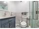 Elegant bathroom with marble walls, modern fixtures, and glass-enclosed shower at 1881 N Hercules Ave # 602, Clearwater, FL 33765