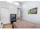 Cozy bedroom featuring light wood floors, storage and a large window for natural light at 1881 N Hercules Ave # 602, Clearwater, FL 33765