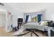 Bright bedroom featuring large windows, gray walls, and a modern platform bed at 1881 N Hercules Ave # 602, Clearwater, FL 33765