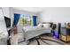 Sunlit bedroom features a large window, gray walls, and a modern platform bed at 1881 N Hercules Ave # 602, Clearwater, FL 33765