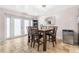 Well-lit dining room with tile flooring and access to the exterior at 1881 N Hercules Ave # 602, Clearwater, FL 33765